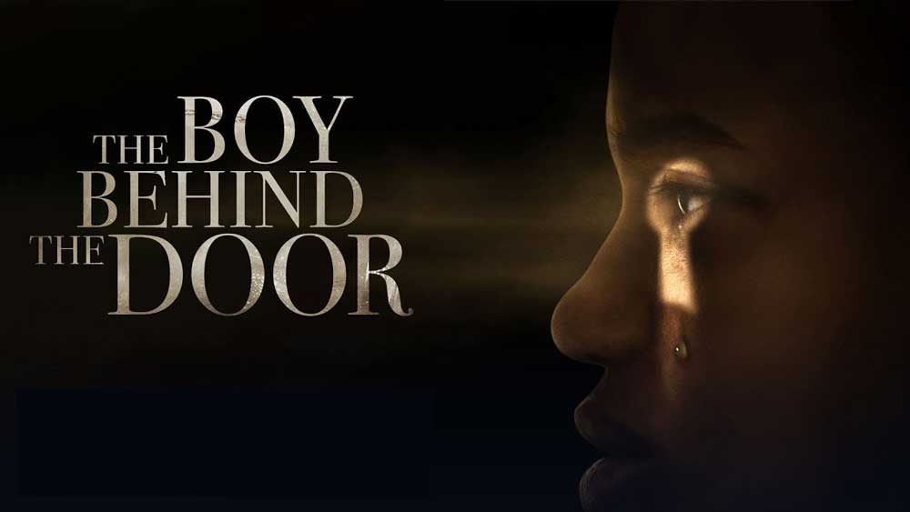 The boy behind the door